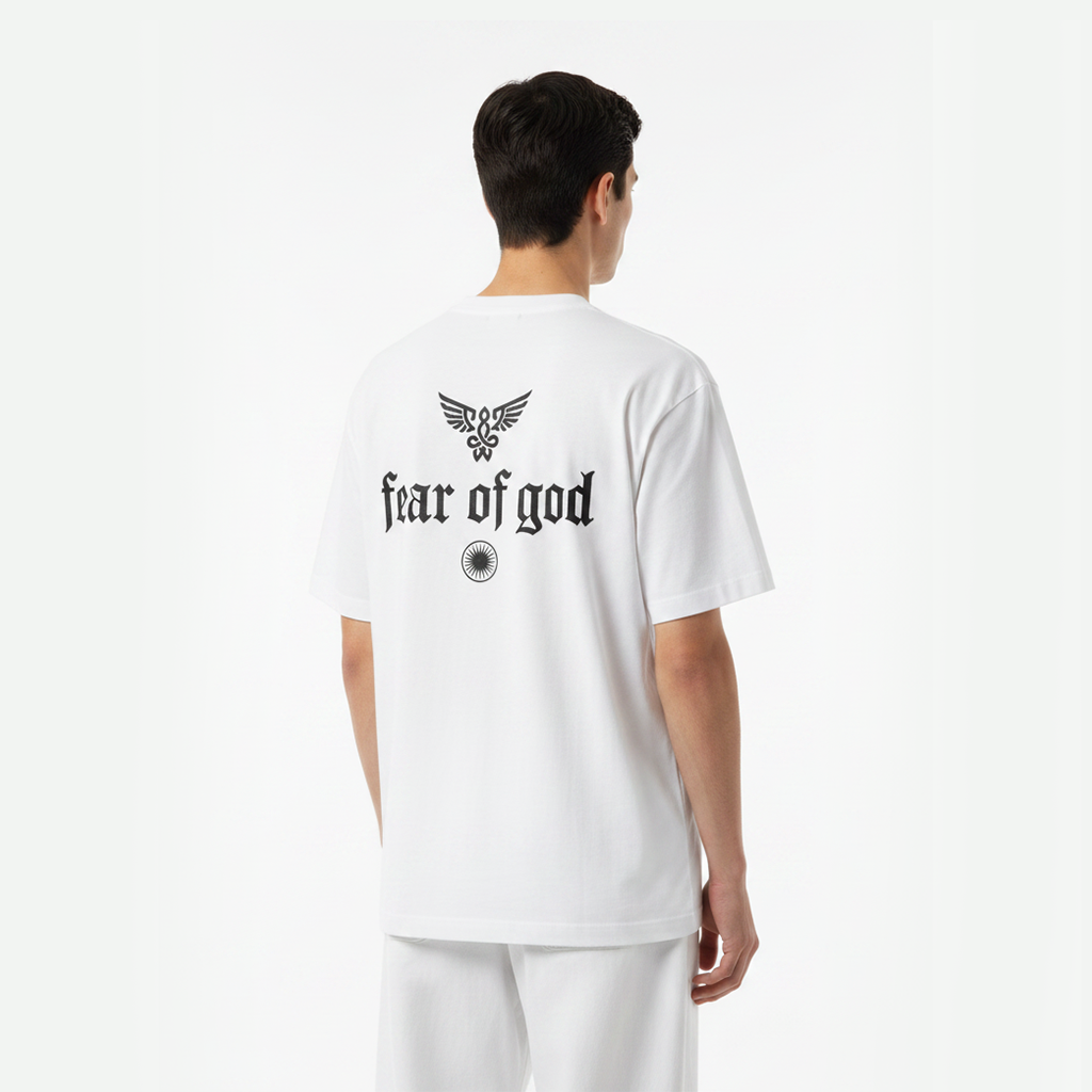 Person wearing a white 'Fear of God' t-shirt with a logo on the back against a white background