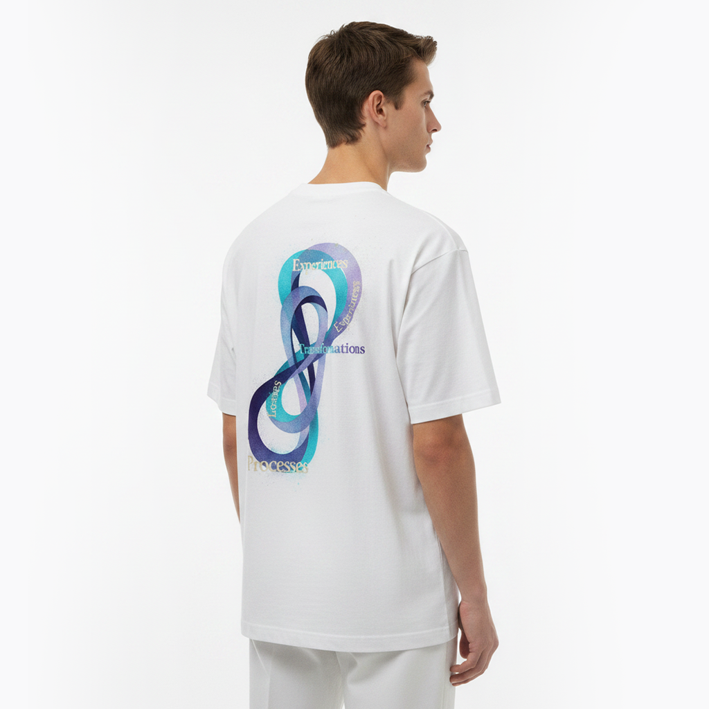 Person wearing a white t-shirt with a colorful design on the back against a white background