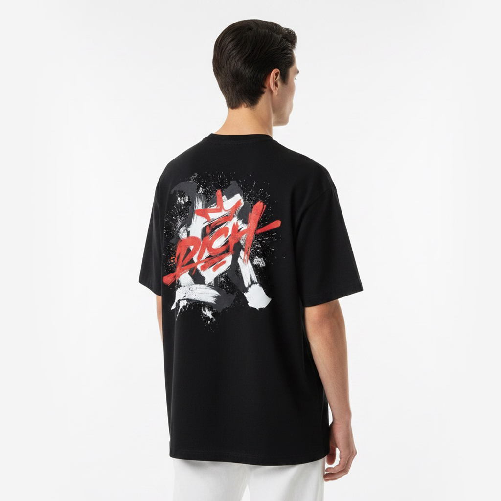 Person wearing a white t-shirt with black and red graphic design on the back against a white background