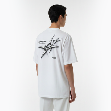 Person wearing a white t-shirt with a graphic design on the back against a white background