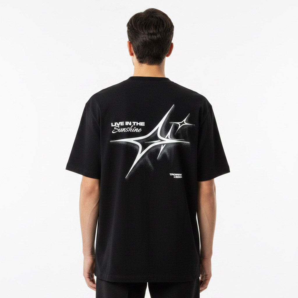 Person wearing a white t-shirt with a graphic design on the back against a white background