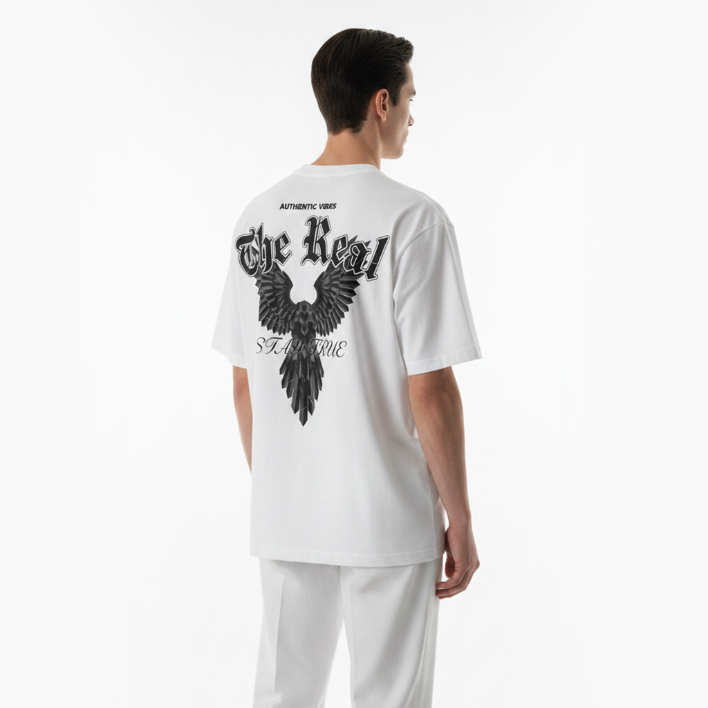 Person wearing a white t-shirt with black eagle design on the back against a white background