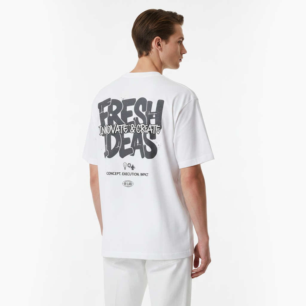 Person wearing a white t-shirt with text on the back against a white background