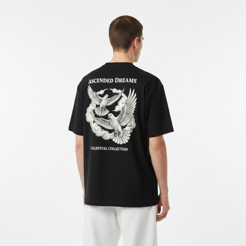 Person wearing a black t-shirt with 'Ascended Dreams' design on the back, standing against a white background.