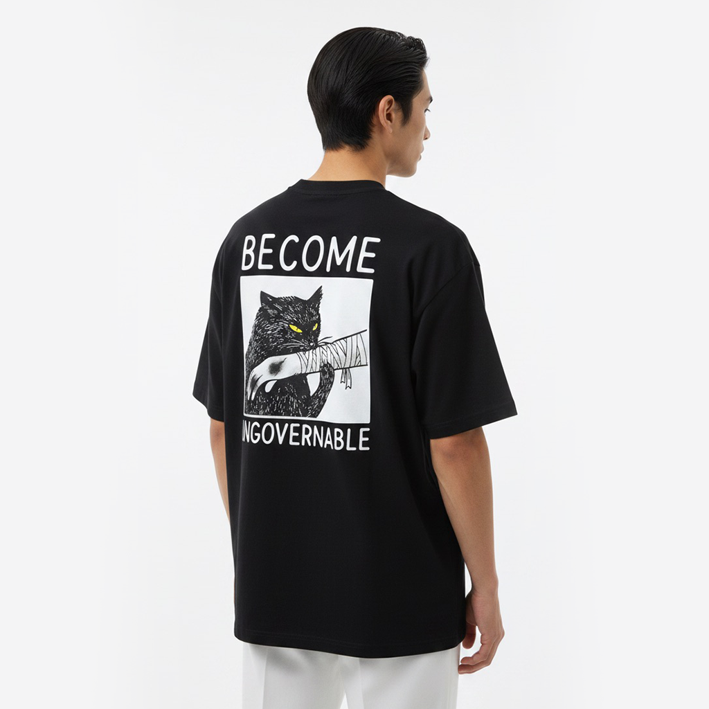 Person wearing a white t-shirt with a graphic design and text on the back, standing against a plain background.