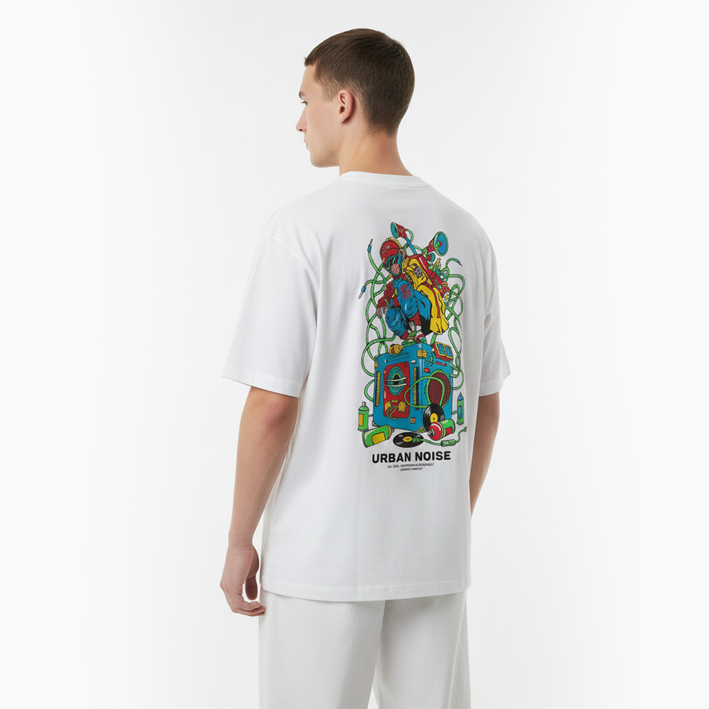 Person wearing a white t-shirt with a colorful graphic design on the back, standing against a white background.