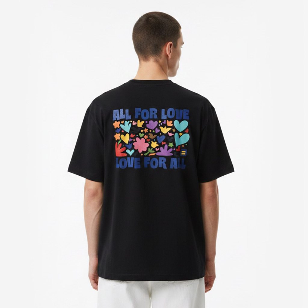 Person wearing a white t-shirt with colorful graphics and text on the back