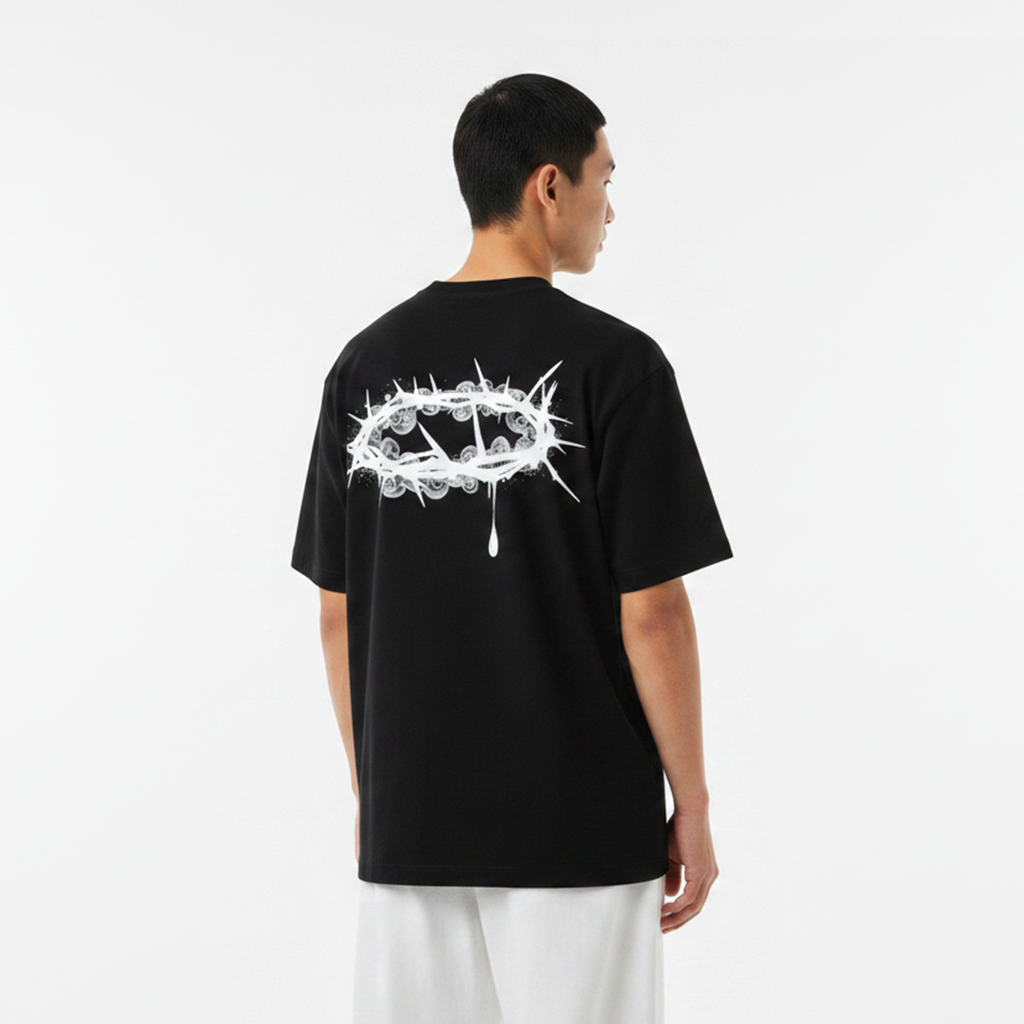 Person wearing a white t-shirt with a black design on the back against a light gray background