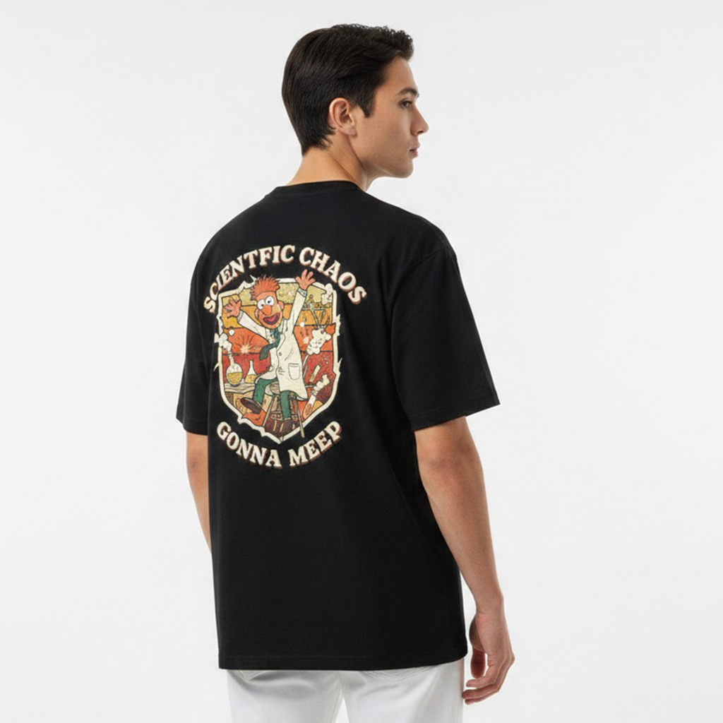 Person wearing a white t-shirt with a colorful graphic on the back against a plain background
