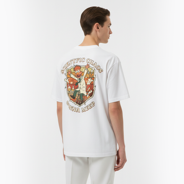 Person wearing a white t-shirt with a colorful graphic on the back against a plain background