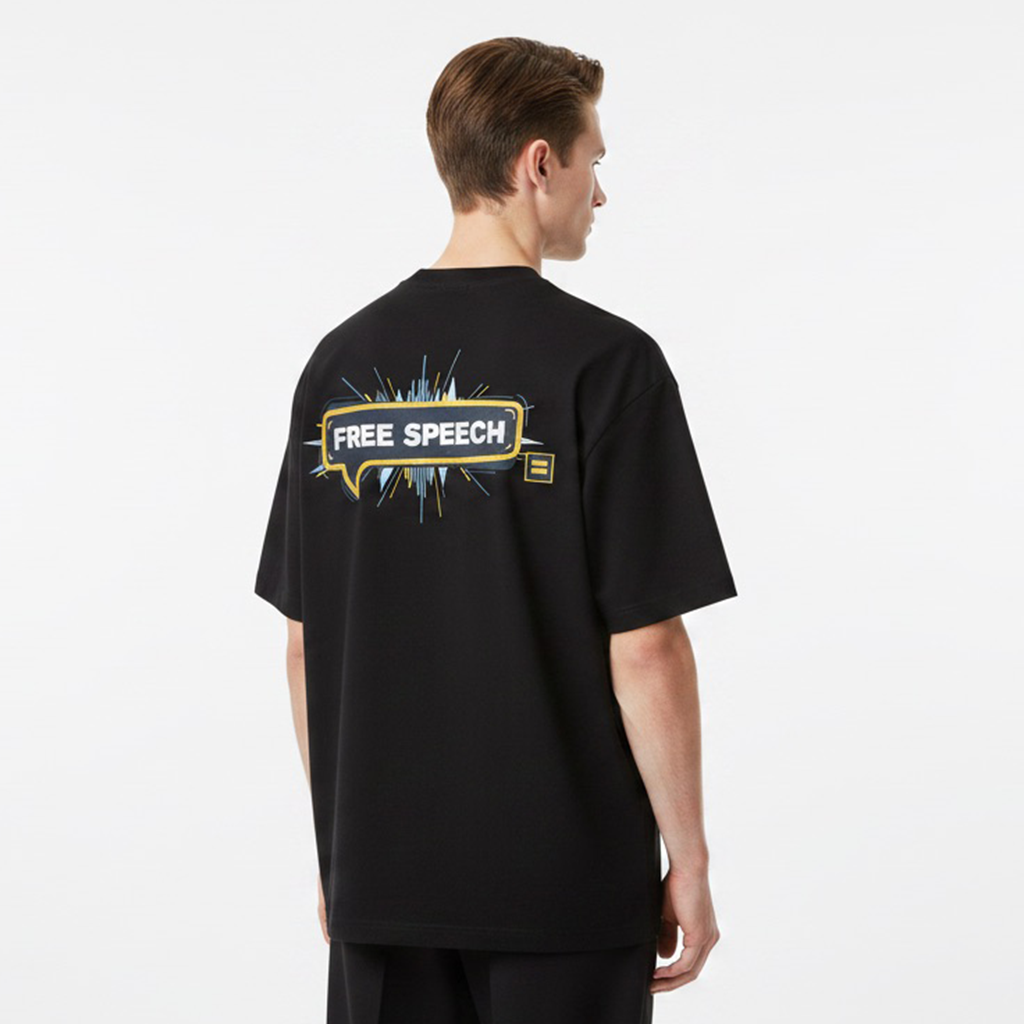 Person wearing a white t-shirt with 'FREE SPEECH' on the back against a plain background