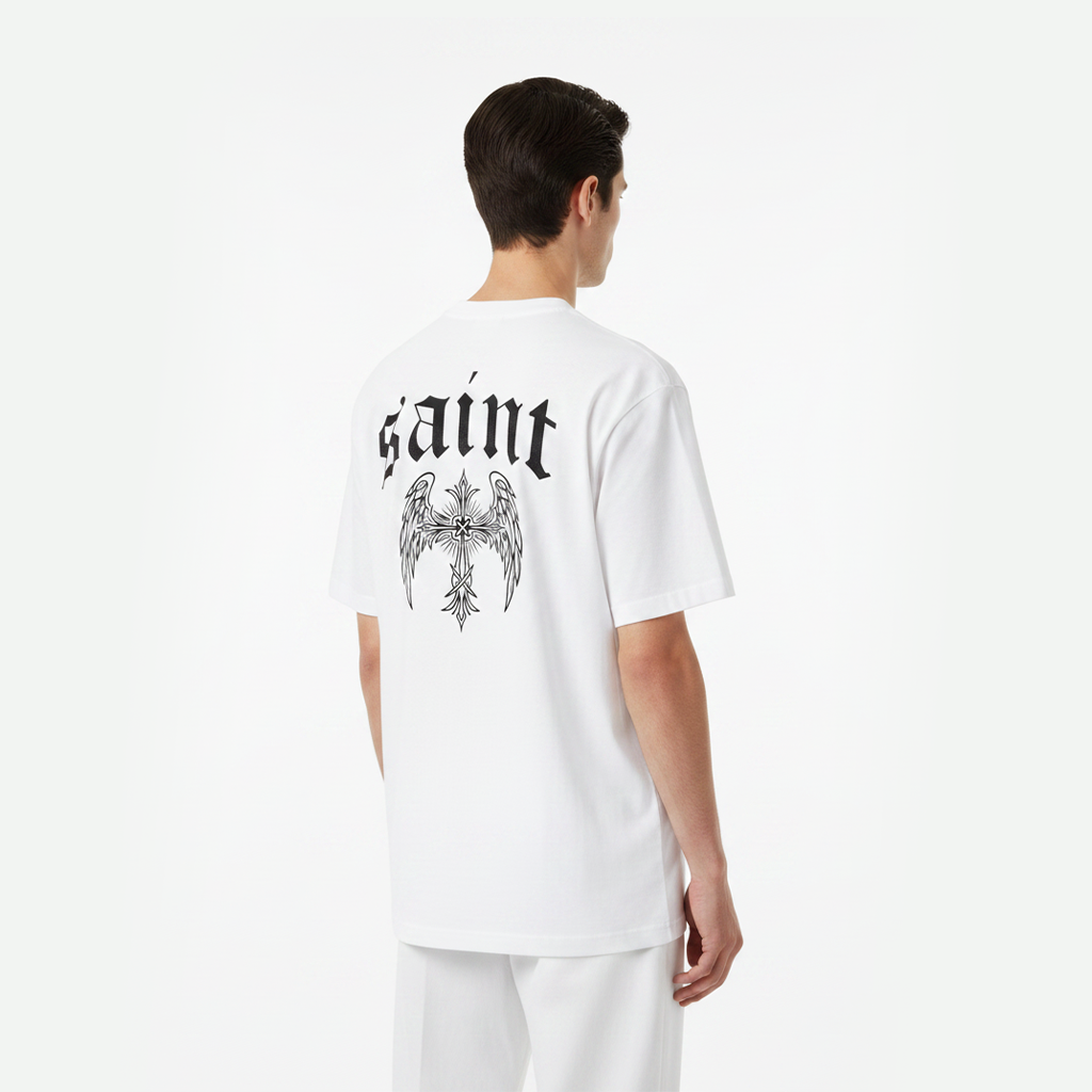 Person wearing a white t-shirt with 'saint' and an eagle design on the back, standing against a white background.