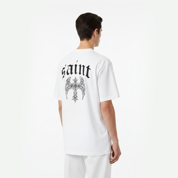Person wearing a white t-shirt with 'saint' and an eagle design on the back, standing against a white background.