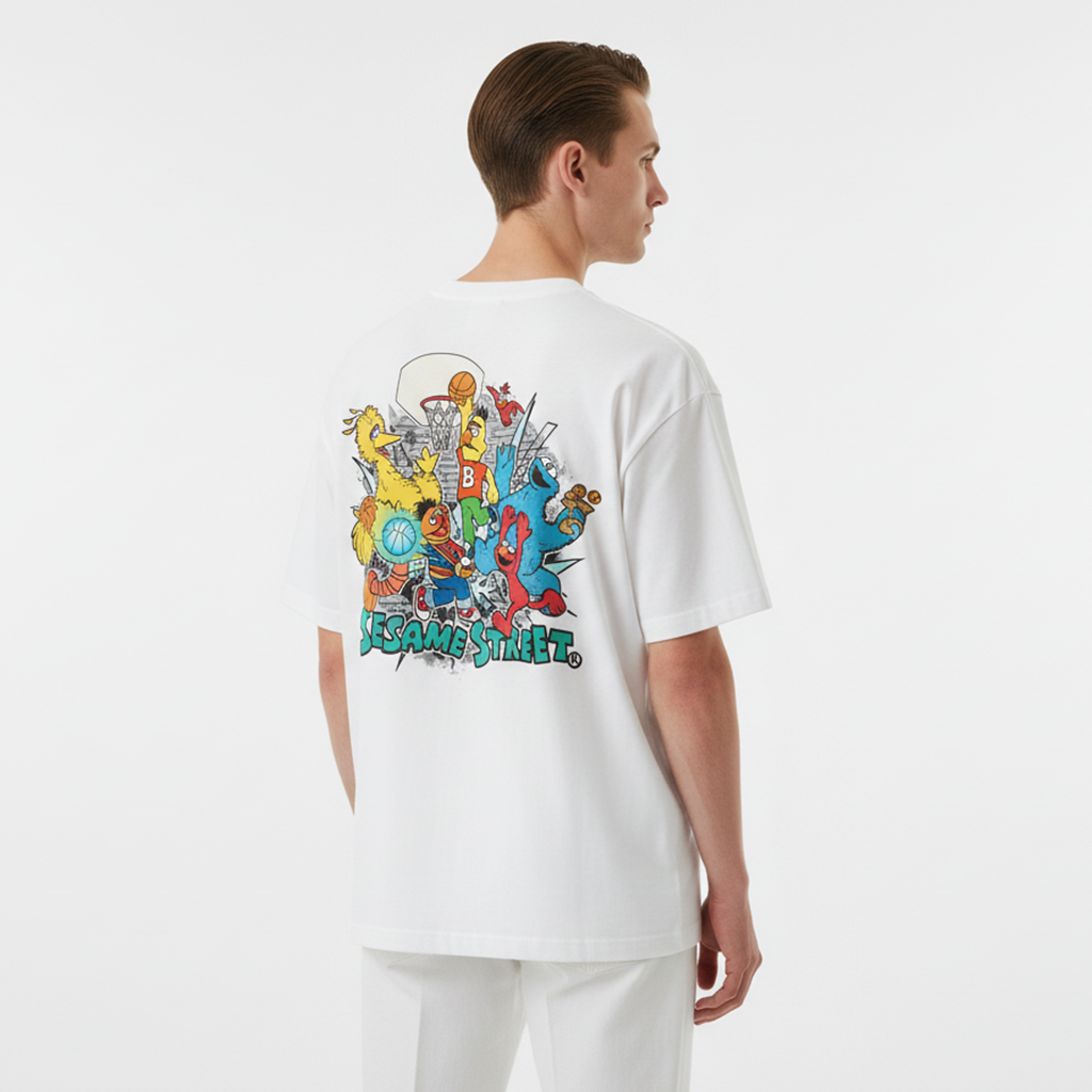 Person wearing a white t-shirt with Sesame Street character design on the back against a white background