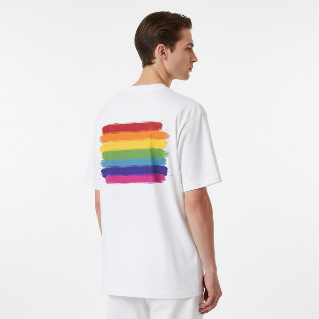 Person wearing a white t-shirt with a rainbow design on the back against a white background