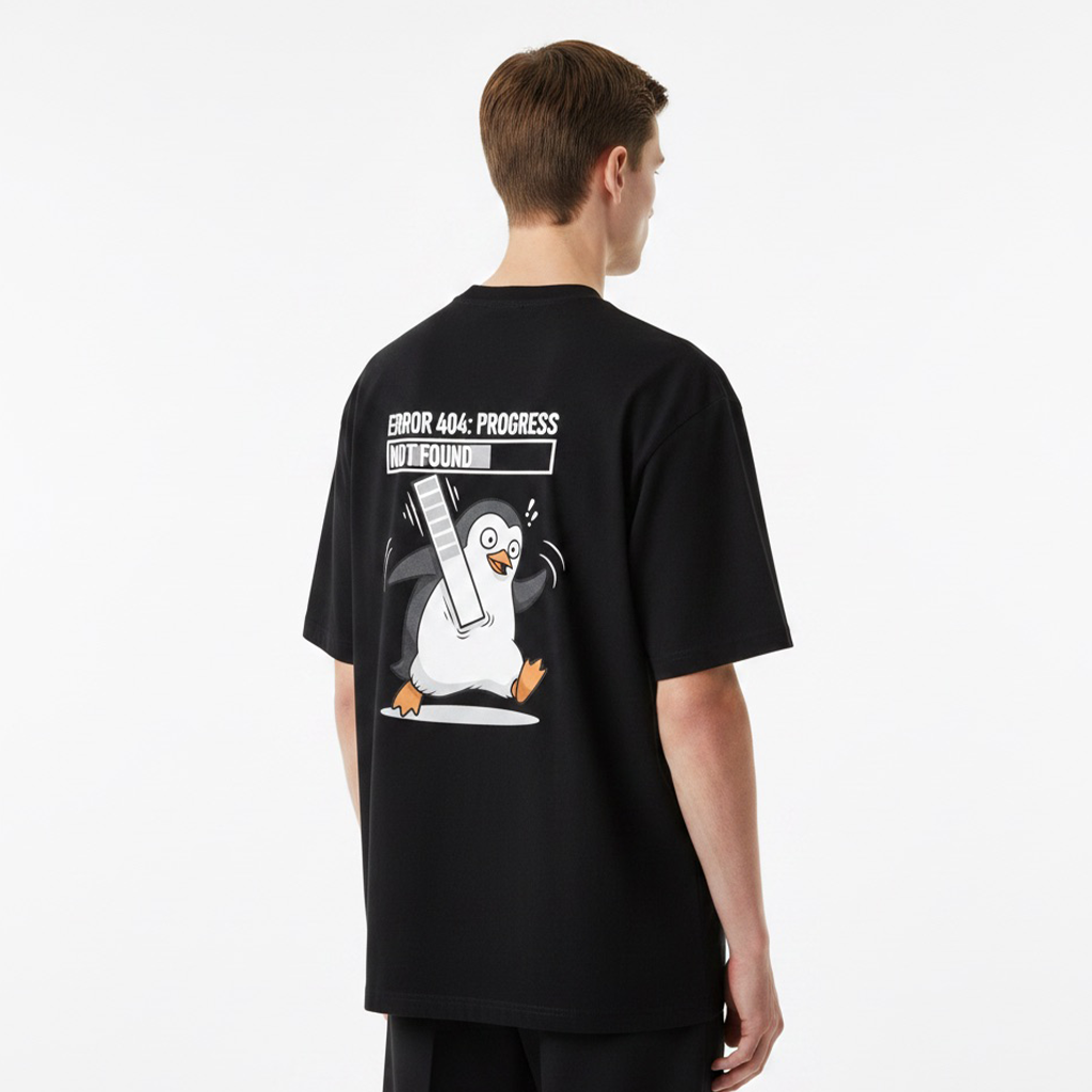 Person wearing a white t-shirt with a penguin graphic and text on the back, standing against a white background.