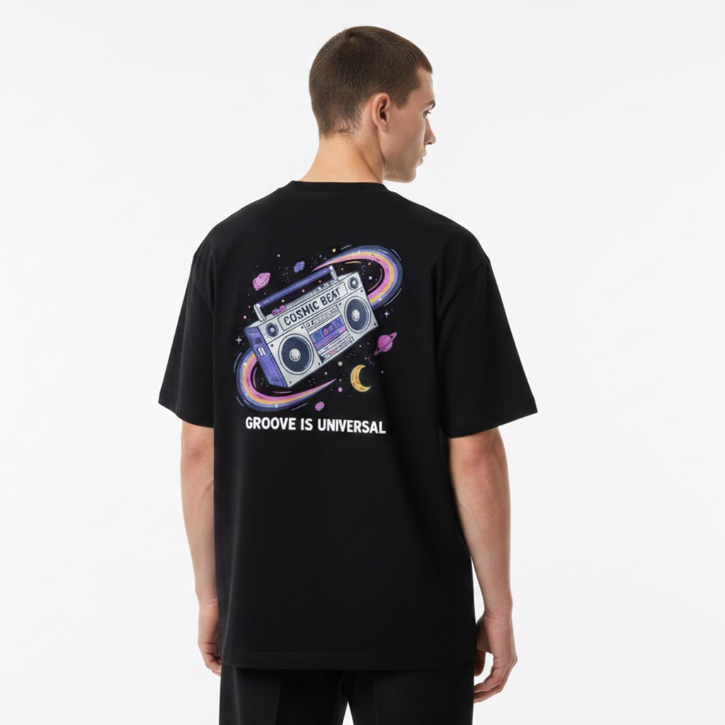 Person wearing a white t-shirt with a colorful graphic and text on the back, standing against a plain background.