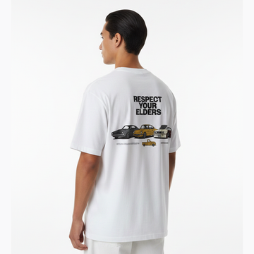 Person wearing a white t-shirt with graphic design and text on the back, standing against a white background.