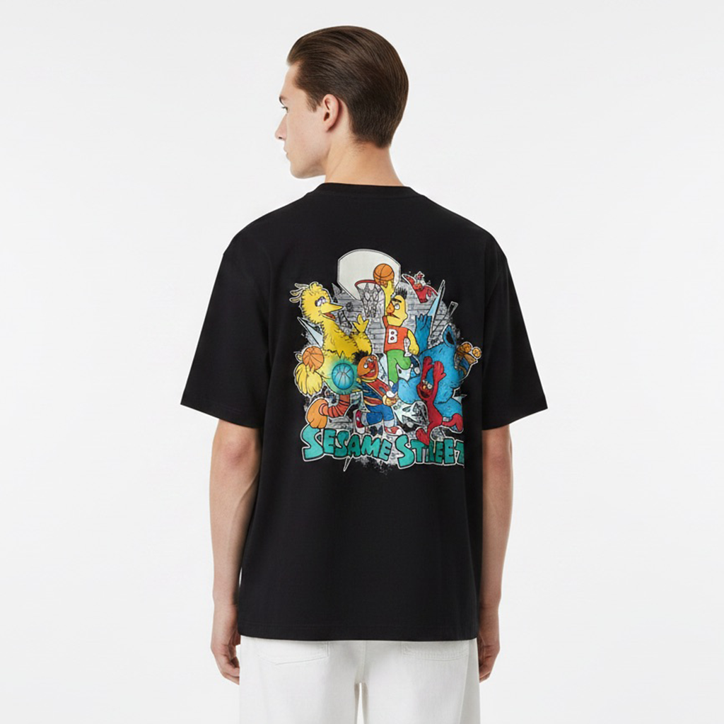 Person wearing a white t-shirt with Sesame Street character design on the back against a white background
