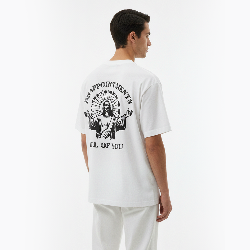 Person wearing a white t-shirt with a graphic design on the back against a white background