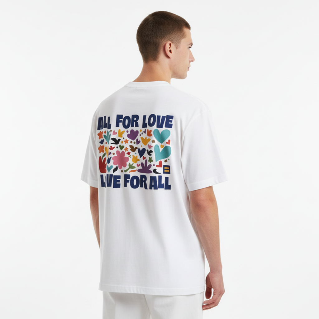 Person wearing a white t-shirt with colorful graphics and text on the back