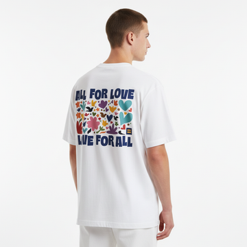 Person wearing a white t-shirt with colorful graphics and text on the back
